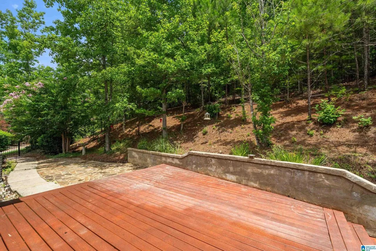 Private wooded backyard beyond the deck